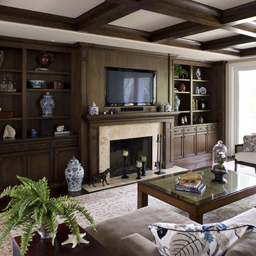 dark stained cabinets and beams, limestone fireplace and hearth