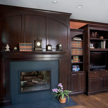 Dark Stained Cherry Library with Raised Hearth Black Absolute Honed Fireplace Su