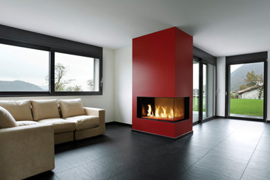 Inspiration for a contemporary ceramic tile and gray floor living room remodel in Phoenix with red walls, a corner fireplace and a plaster fireplace