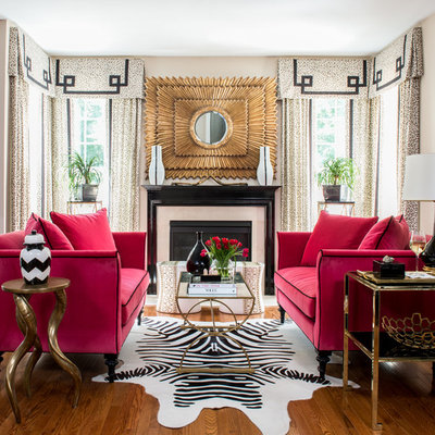 Example of a transitional formal medium tone wood floor living room design in DC Metro with a standard fireplace and no tv