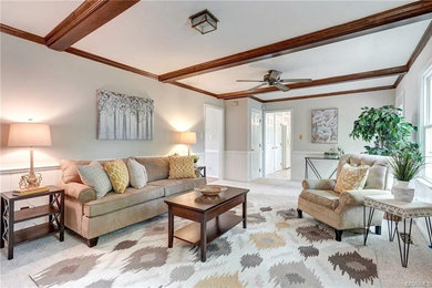 Inspiration for a mid-sized timeless open concept carpeted and exposed beam living room remodel in Richmond with beige walls