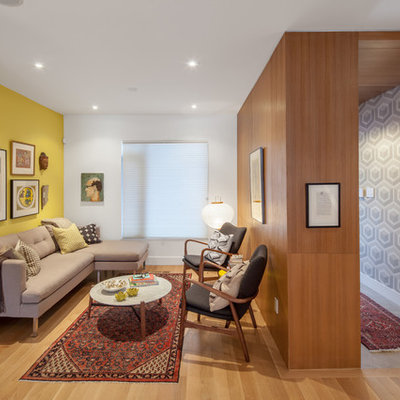 Trendy formal light wood floor living room photo in Toronto with yellow walls