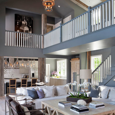 Large beach style open concept and formal light wood floor living room photo in Charlotte with no fireplace and gray walls