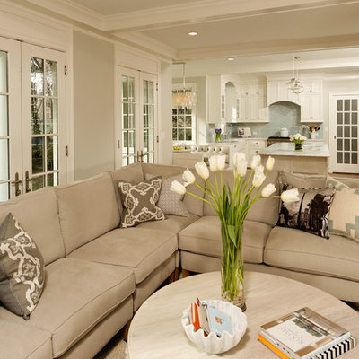 Elegant open concept living room photo in DC Metro with beige walls