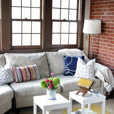 Example of an eclectic living room design in Houston with red walls