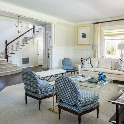 Living room - large traditional formal and enclosed dark wood floor and brown floor living room idea in New York with beige walls, a corner fireplace, a concrete fireplace and no tv