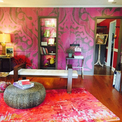 Inspiration for a contemporary medium tone wood floor living room remodel in Orange County with purple walls