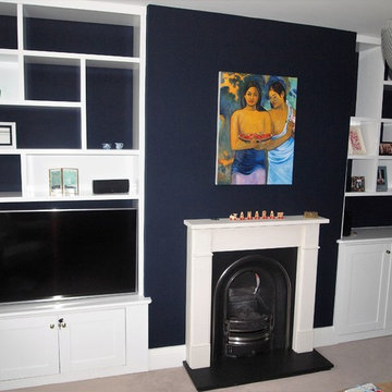Designer Alcove Shelves with Pocket Door Media Centre and Cupboards