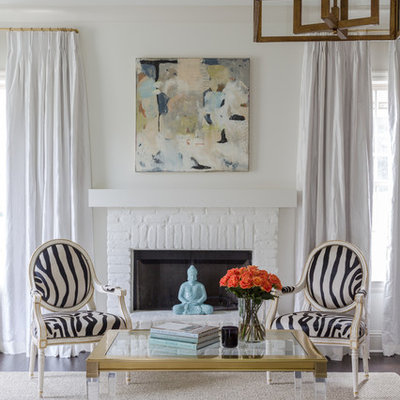 Mid-sized elegant formal and enclosed dark wood floor living room photo in New Orleans with white walls, a standard fireplace, a brick fireplace and no tv