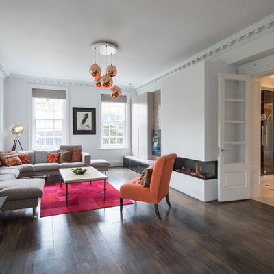 Inspiration for a contemporary formal and enclosed dark wood floor and brown floor living room remodel in London with white walls and a ribbon fireplace