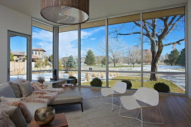 Inspiration for a mid-sized contemporary open concept living room remodel in Denver with white walls