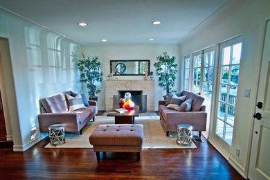 Living room - transitional formal and enclosed dark wood floor and brown floor living room idea in Los Angeles with white walls, a standard fireplace and a brick fireplace