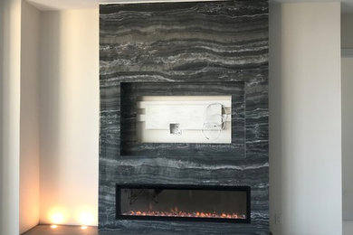 Mid-sized trendy porcelain tile and white floor living room photo in Tampa with white walls, a ribbon fireplace, a tile fireplace and a media wall