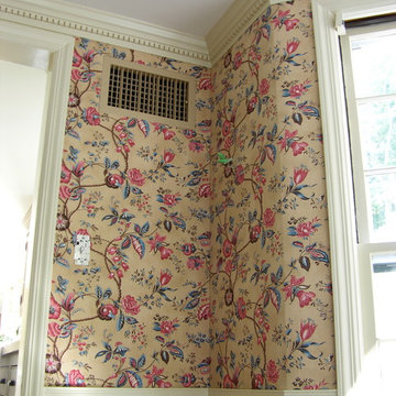 Dining room with printed flowers fabric on the walls