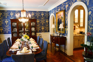 Inspiration for a dark wood floor dining room remodel in Raleigh with blue walls