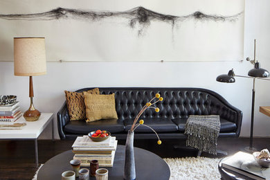 Example of a mid-sized trendy open concept dark wood floor living room design in Chicago with white walls and no tv