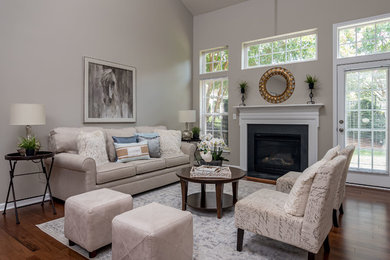 Example of a small transitional living room design in Charlotte with gray walls