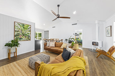 Mid-sized beach style open concept vinyl floor living room photo in Sunshine Coast with white walls
