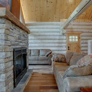 Double Sided Stacked Stone Fireplace with Barn Wood Mantels