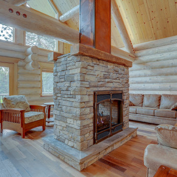 Double Sided Stacked Stone Fireplace with Barn Wood Mantels