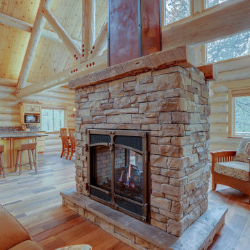 Double Sided Stacked Stone Fireplace with Barn Wood Mantels