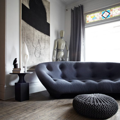 Example of a trendy dark wood floor living room design in Toronto with white walls