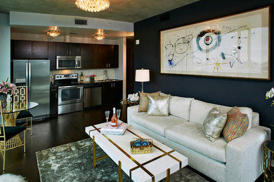 Example of a small eclectic open concept dark wood floor living room design in Dallas with gray walls, no fireplace and no tv