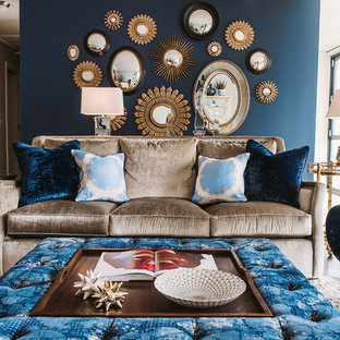 Transitional medium tone wood floor living room photo in Chicago with blue walls