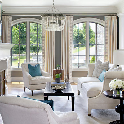 Inspiration for a timeless formal medium tone wood floor living room remodel in Philadelphia with gray walls, a standard fireplace and no tv