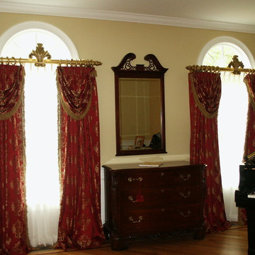 Draperies with Swag Overlays on Arch Window, Decorative Rods & Crown