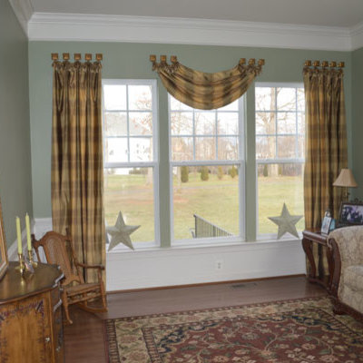 Inspiration for a mid-sized timeless formal and enclosed dark wood floor and brown floor living room remodel in DC Metro with green walls, no fireplace and no tv