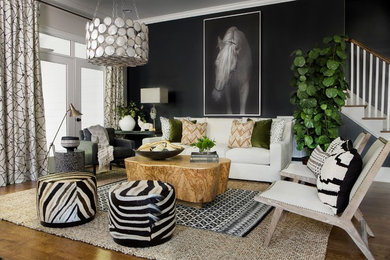 Trendy dark wood floor and brown floor living room photo in Other with black walls