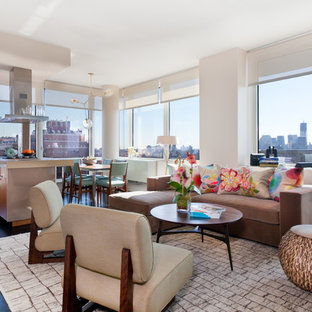 Inspiration for a large contemporary open concept dark wood floor and brown floor living room remodel in New York with white walls, no fireplace, a plaster fireplace and a wall-mounted tv