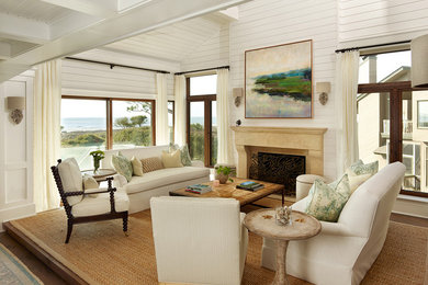 Example of a mid-sized beach style open concept dark wood floor living room design in Charleston with white walls and a standard fireplace