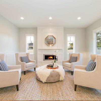 Inspiration for a large timeless formal and enclosed light wood floor living room remodel in Orange County with gray walls, a ribbon fireplace, no tv and a metal fireplace