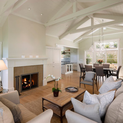 Living room - mid-sized traditional formal and open concept medium tone wood floor living room idea in Santa Barbara with a tile fireplace, white walls, a standard fireplace and no tv
