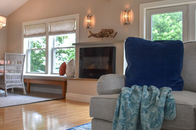 Inspiration for a coastal medium tone wood floor living room remodel in Portland Maine with gray walls