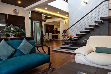 Trendy living room photo in Bengaluru
