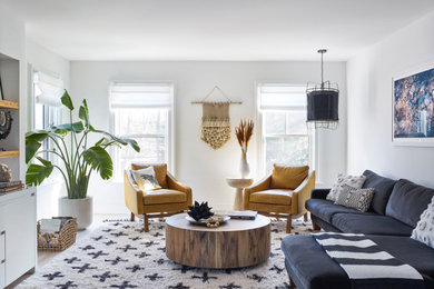 Example of a large eclectic living room design in New York with white walls