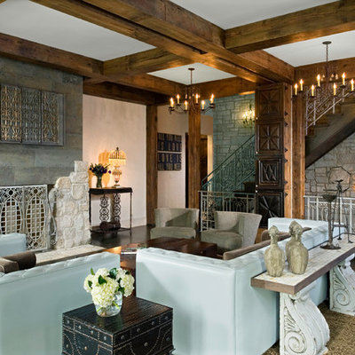 Large mountain style open concept dark wood floor and brown floor living room photo in Chicago with a standard fireplace, a concealed tv, beige walls and a tile fireplace