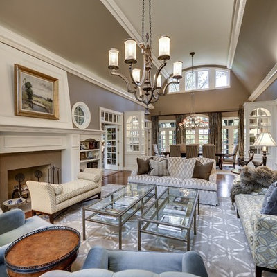 Elegant open concept living room photo in Minneapolis with brown walls, a standard fireplace and no tv
