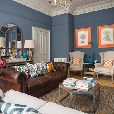 Example of a mid-sized transitional enclosed light wood floor and beige floor living room design in Edinburgh with blue walls