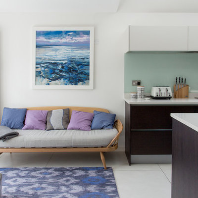 Mid-sized trendy open concept living room photo in London with white walls and no fireplace