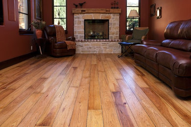 Mid-sized southwest formal and enclosed light wood floor living room photo in San Francisco with yellow walls, no tv, a standard fireplace and a stone fireplace