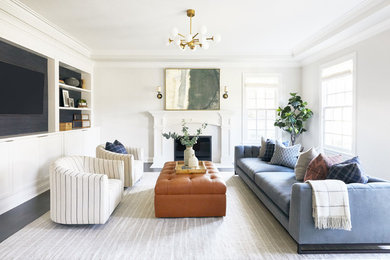 Living room - transitional dark wood floor and gray floor living room idea in San Francisco with white walls, a standard fireplace and a wall-mounted tv