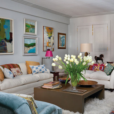Inspiration for an eclectic enclosed living room remodel in New York with white walls