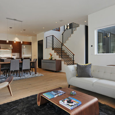 Living room - mid-sized 1950s open concept medium tone wood floor living room idea in Seattle with white walls, a standard fireplace, a metal fireplace and a tv stand