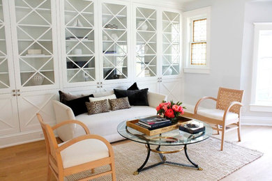 Living room - mid-sized transitional formal and enclosed light wood floor living room idea in Toronto with white walls and no tv