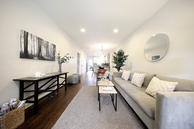 Example of a mid-sized trendy open concept dark wood floor living room design in Chicago with gray walls