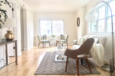 Living room - mid-sized scandinavian formal and enclosed light wood floor and beige floor living room idea in Chicago with white walls, no fireplace and no tv